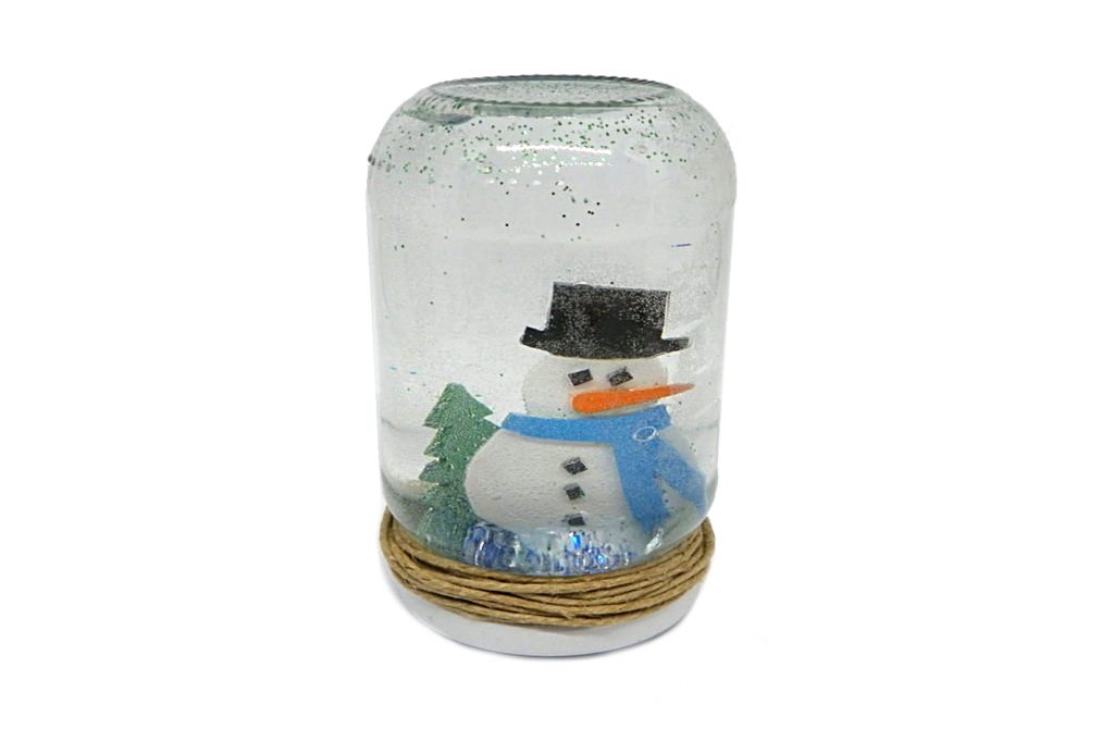 frasco de nieve hecho con un tarro de cristal y goma eva de colores