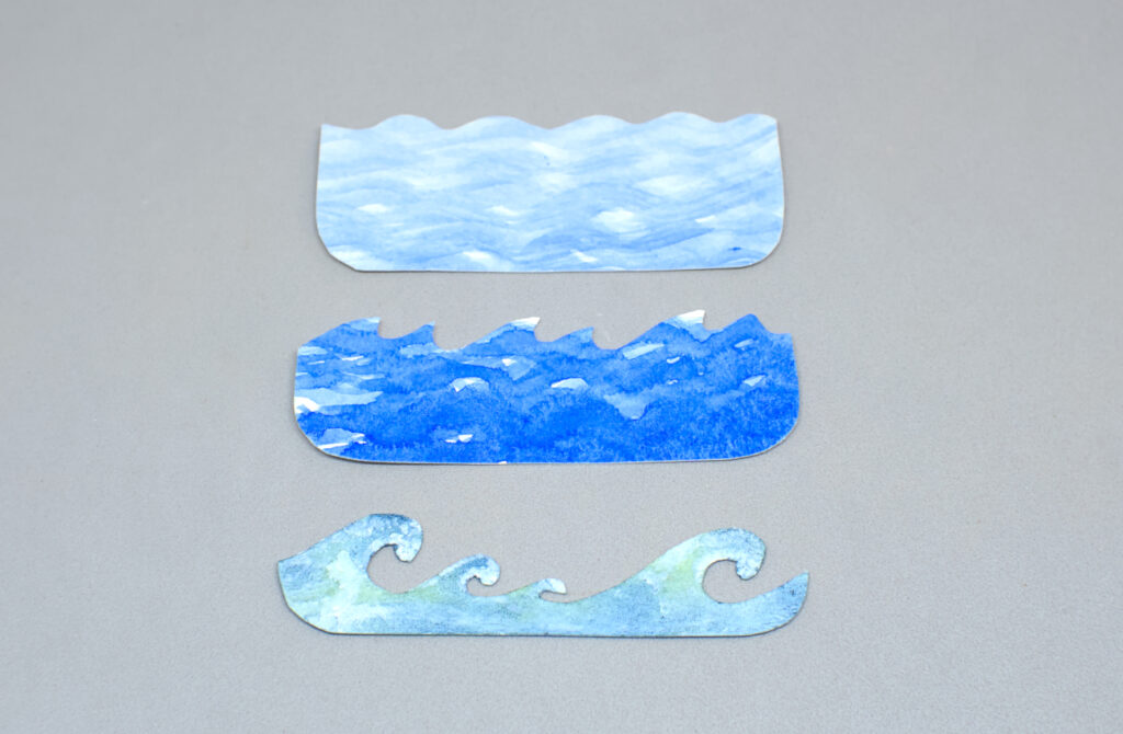 piezas de papel pintadas con acuarelas de la mar en marejada