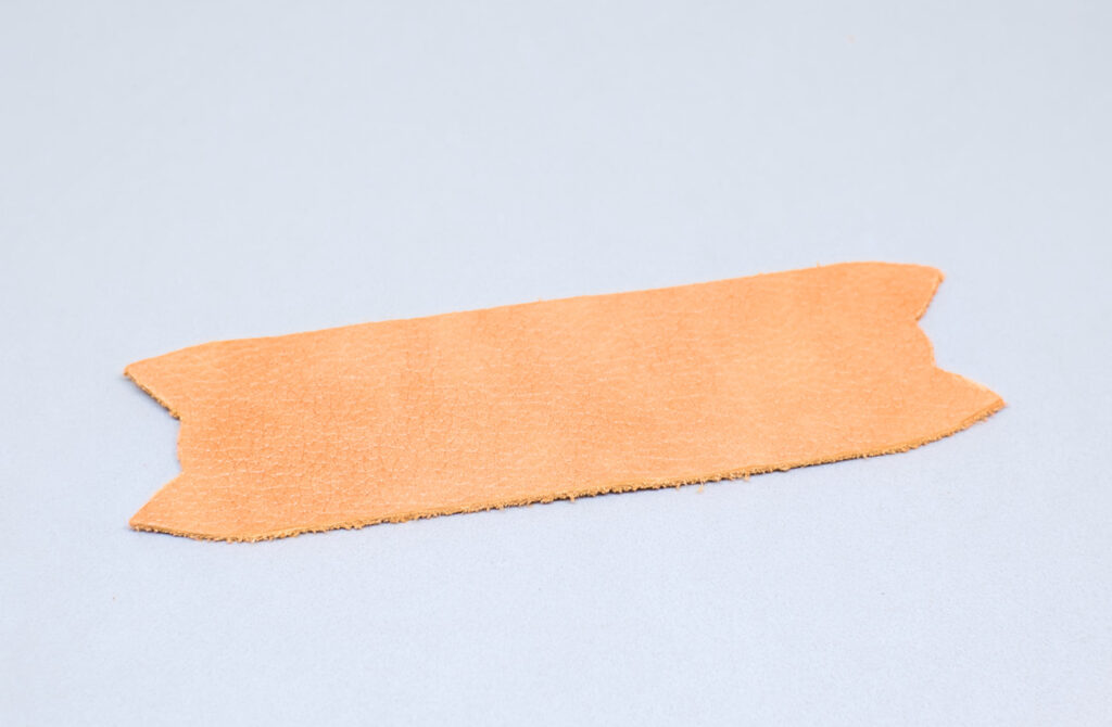 tira de cuero bombeado naranja para hacer organizador de cables